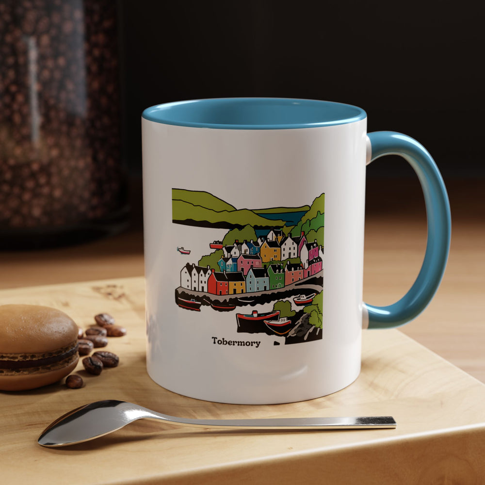 Experience the beauty of Tobermory with this exquisite mug featuring detailed artwork of the town and its iconic sights. Ideal for hot beverages, this ceramic 11oz mug is microwave safe and dishwasher safe. A thoughtful gift for those who appreciate scenic beauty and artistic design.