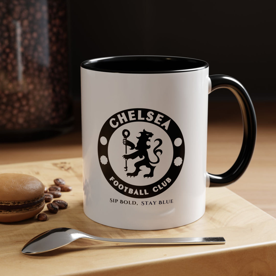 Sleek black Chelsea FC ceramic mug with a fan-inspired design, perfect for coffee, tea, or hot chocolate. Durable and functional, it allows fans to show subtle team pride while enjoying their favorite beverages. Ideal for home, office, or gifting to supporters who love practical and stylish football merchandise.