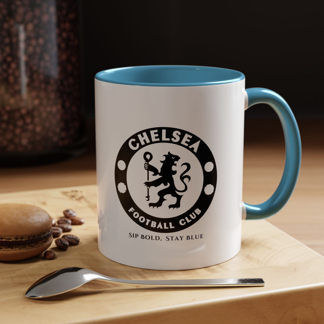 A Chelsea FC fan mug in blue ceramic featuring a vibrant, fan-inspired design. Ideal for enjoying coffee, tea, or hot beverages, it’s durable and eye-catching, perfect for game-day routines, office use, or gifting to dedicated Blues supporters who want both style and function.