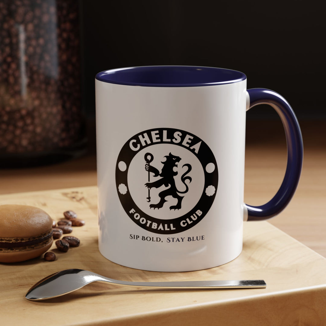 Navy blue Chelsea FC ceramic mug featuring a fan-focused design. Perfect for coffee, tea, or hot chocolate, it’s functional, elegant, and durable, making it suitable for home, office, or gifting. This mug is a stylish way for supporters to celebrate their love for the Blues and the Premier League.