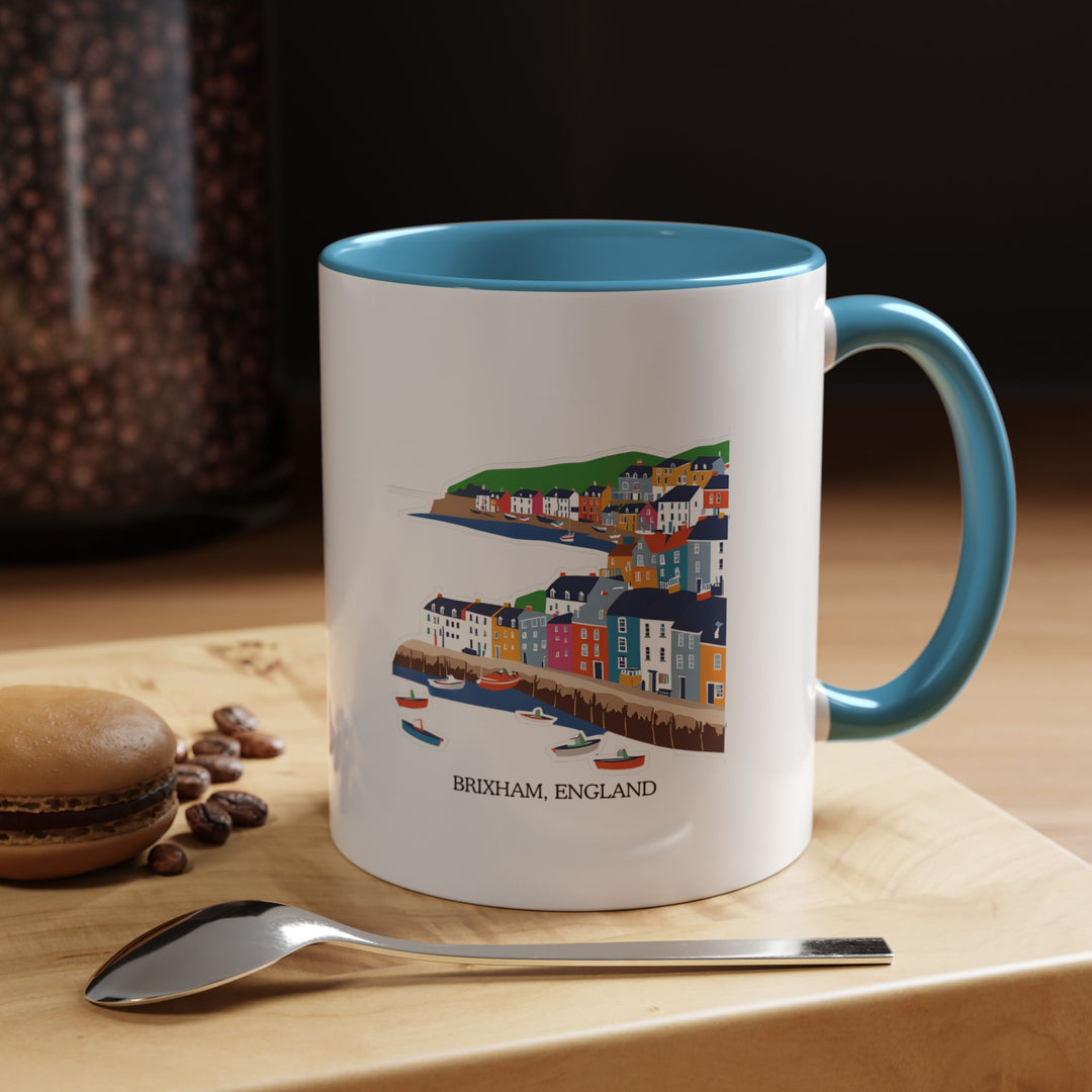 This Brixham England mug captures the beauty of Brixham’s coastal landscape. Ideal for coffee lovers, it features stunning artwork inspired by Brixham’s colorful harbors. Durable, microwave safe, and dishwasher safe, this mug makes an excellent gift for travelers.