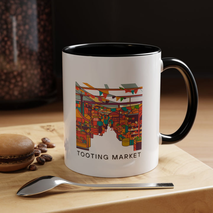 A stylish Tooting Market mug perfect for adding charm to your coffee or tea time. Showcasing vibrant designs inspired by the markets energy, it is durable and dishwasher safe. An excellent gift for travelers, collectors, or anyone who appreciates Londons diverse culture.