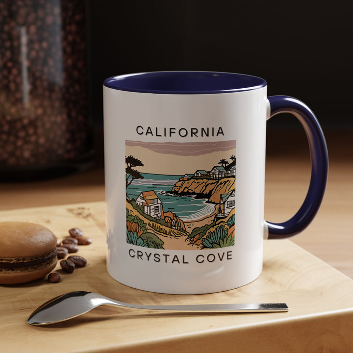 A beautifully designed Crystal Cove California mug celebrating the charm of the beach. Perfect for coffee lovers, it features vibrant artwork inspired by the stunning Crystal Cove coastline. Dishwasher and microwave safe, this mug is a meaningful gift or keepsake for beach enthusiasts.