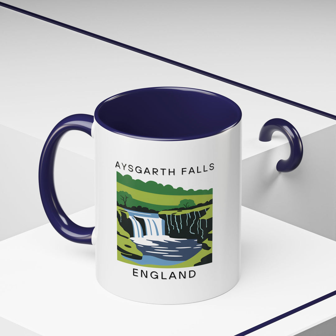 Discover the beauty of Aysgarth Falls with this ceramic mug featuring a detailed design of the famous falls. A perfect gift or personal keepsake, this mug is dishwasher and microwave safe, ideal for everyday use.