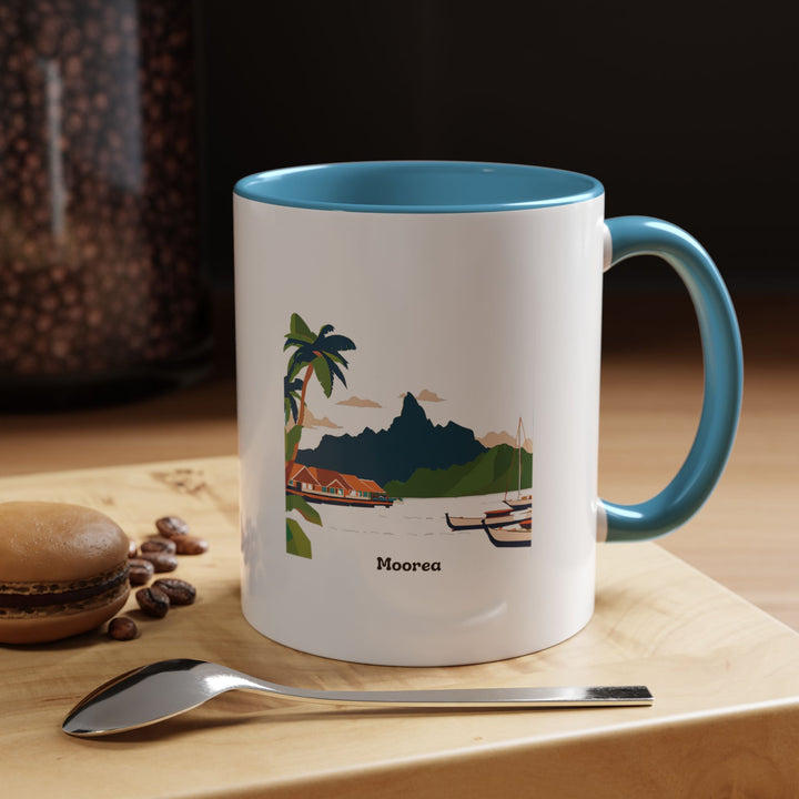 A stunning Mo'orea Mug showcasing intricate designs reflecting the breathtaking beauty of Mo'orea’s mountains and clear lagoons. Dishwasher and microwave safe, this ceramic mug is ideal for daily use or as a meaningful gift for tropical destination enthusiasts.