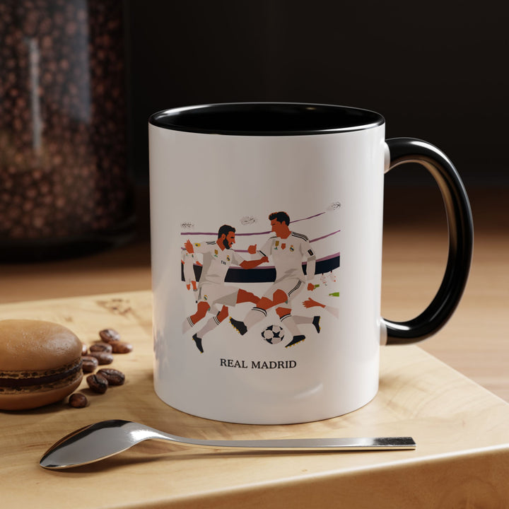 This Real Madrid mug celebrates the legendary football club with vibrant designs. Perfect for coffee or tea lovers, it showcases Real Madrid’s iconic colors and logos. Durable and dishwasher safe, it’s the ideal gift for fans of the club.