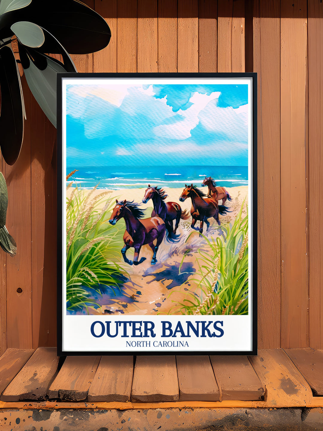 Corolla Wild Horses Framed Art capturing the untamed beauty and spirit of freedom embodied by the wild horses of the Outer Banks. The framed artwork is ideal for those who appreciate the natural world and the unique charm of North Carolinas coastal region. Perfect for adding a touch of wildlife to any decor.