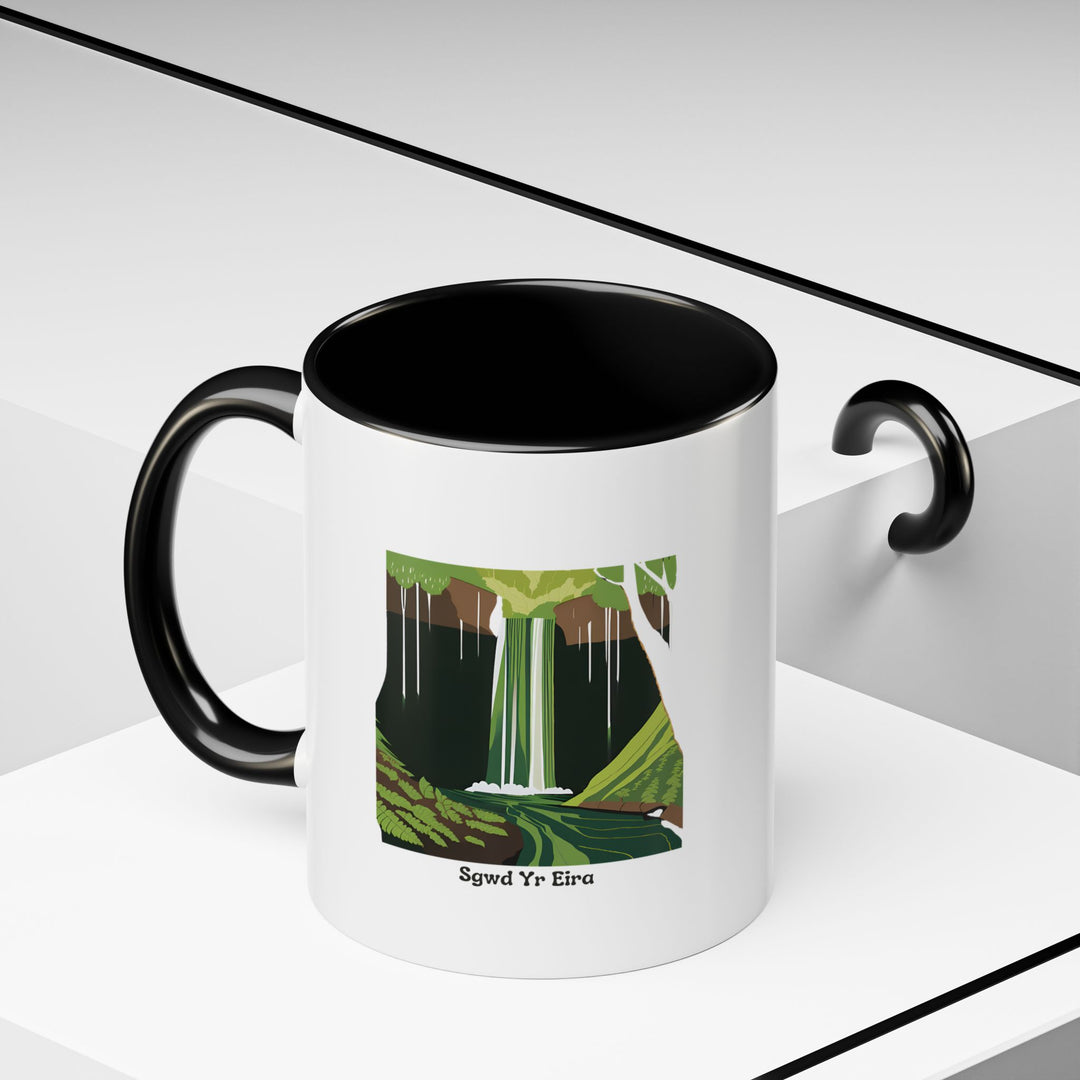 The Sgwd Yr Eira Waterfall Mug brings Wales's iconic waterfall to life with vibrant artwork. Made from durable ceramic, it is dishwasher-safe and microwave-safe for convenience.