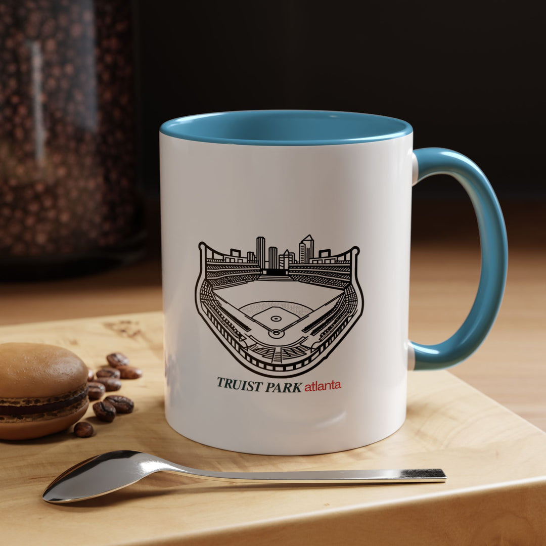 Experience the excitement of baseball with this Truist Park Atlanta Mug showcasing vibrant images of the stadium. Made from high quality ceramic, it is dishwasher and microwave safe. Ideal for daily use, it brings touch of Atlantas sports culture to your coffee or tea time.