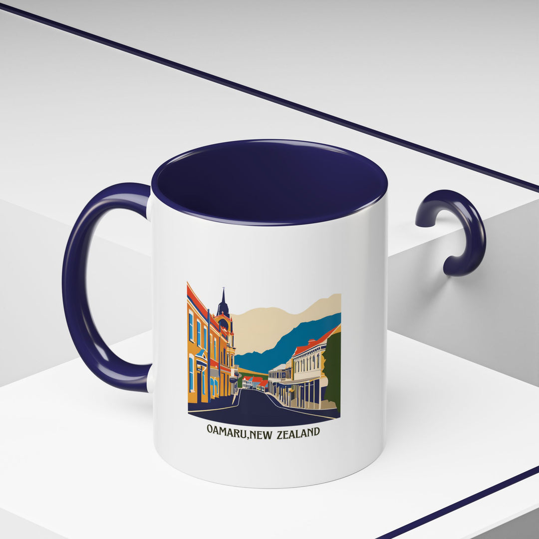 Enjoy a piece of Oamaru New Zealand with this beautifully designed ceramic mug. Featuring vibrant artwork inspired by the town’s scenic landscapes, it is microwave and dishwasher safe, making it both practical and artistic.