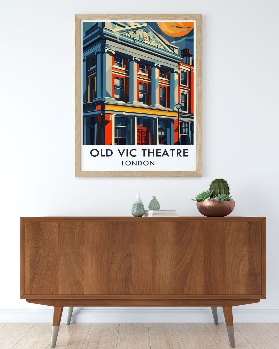 This London travel poster beautifully captures The Old Vic Theatres iconic exterior in a striking art deco design. Perfect for lovers of Londons West End and vintage style, this Old Vic art print adds elegance to any space. The poster features vibrant colors and is ideal for home or office décor.