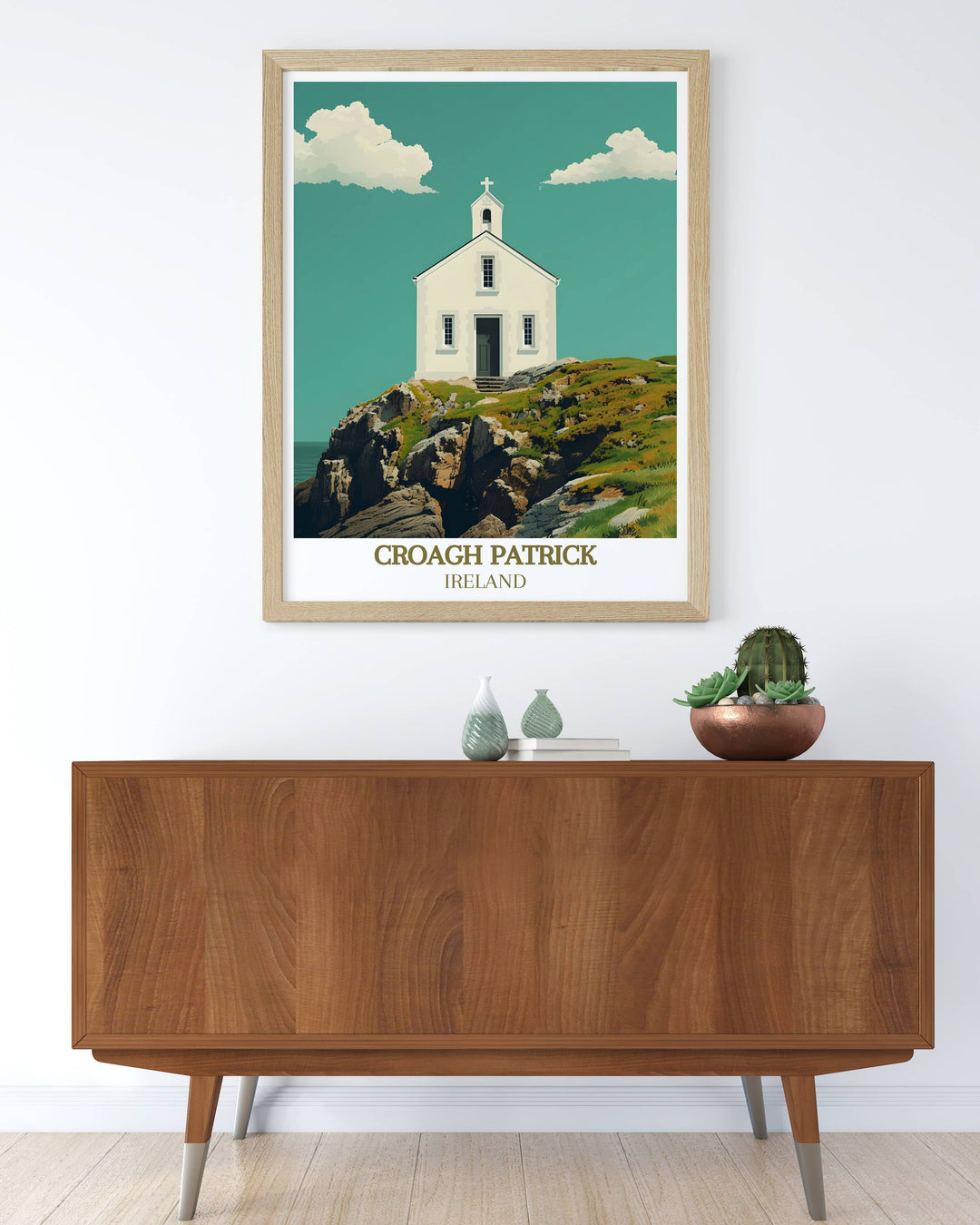 A vintage travel print showcasing the beauty of St Patricks Church and Croagh Patrick in County Mayo Ireland. This framed print highlights the serene landscapes and spiritual history making it a wonderful addition to any travel inspired decor.