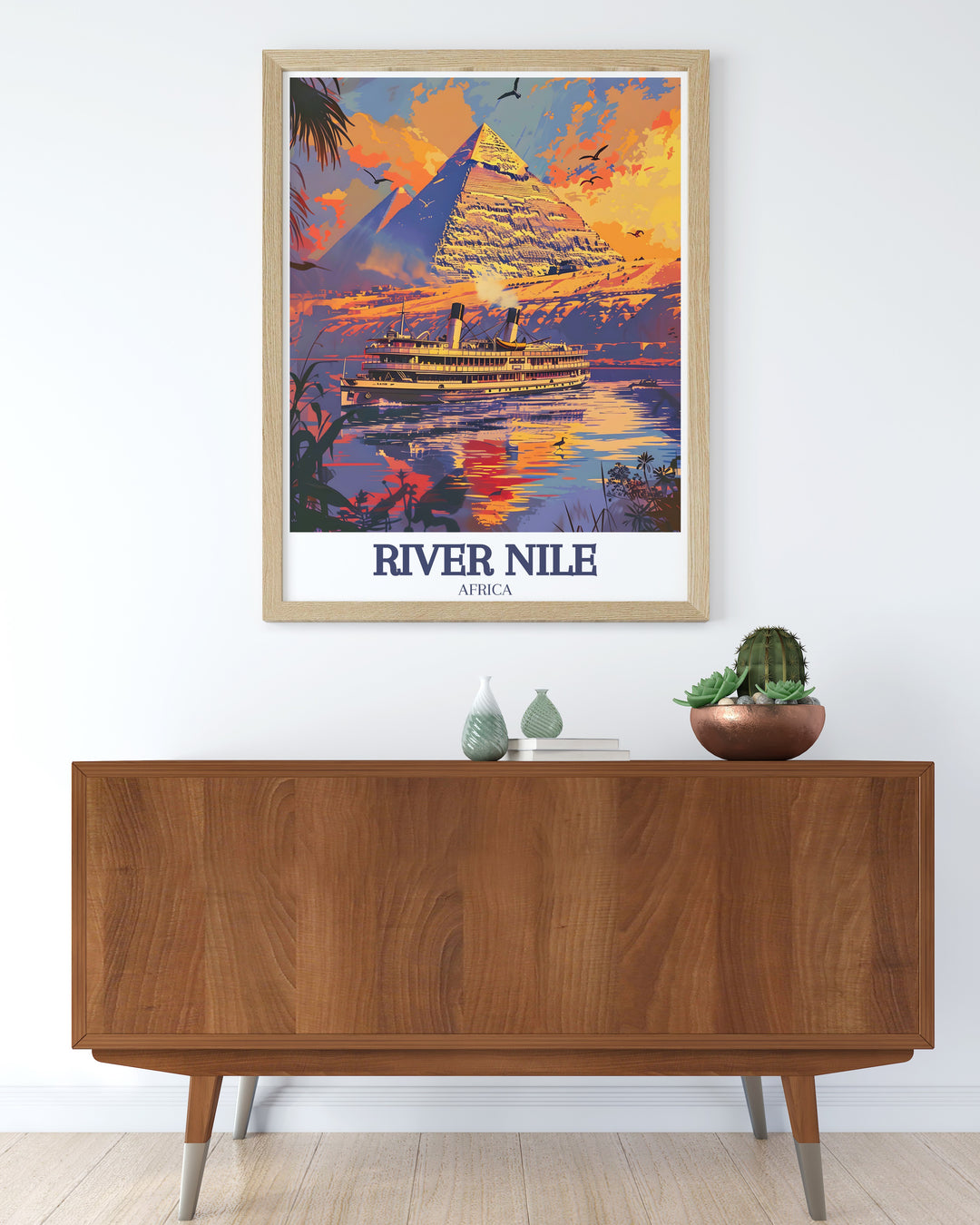 Featuring the River Nile and Pyramids of Giza, this Egypt Travel Print is a stunning representation of two of Egypts most famous landmarks. The harmonious blend of nature and ancient architecture makes this piece a standout choice for any lover of travel or history.