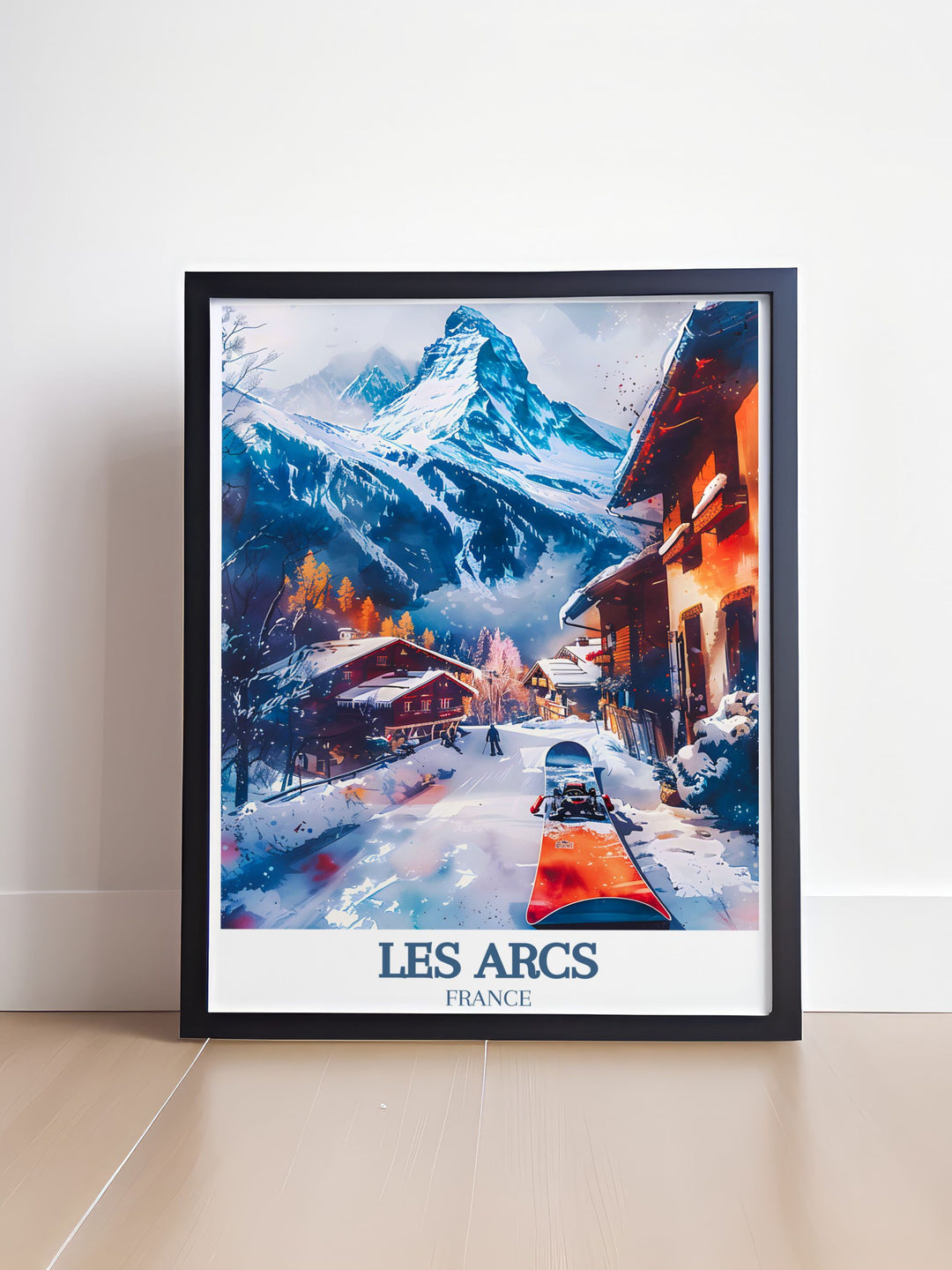 a framed picture of a snowy mountain town