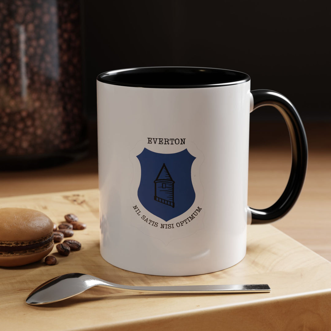 Sleek black Everton FC mug featuring the iconic club crest, perfect for committed supporters of The Toffees. Ideal for enjoying coffee, tea, or hot chocolate, with a durable ceramic build and comfortable handle for daily use. A stylish supporter gift, collectible, or desk display piece that brings club pride into everyday moments wherever it is used.