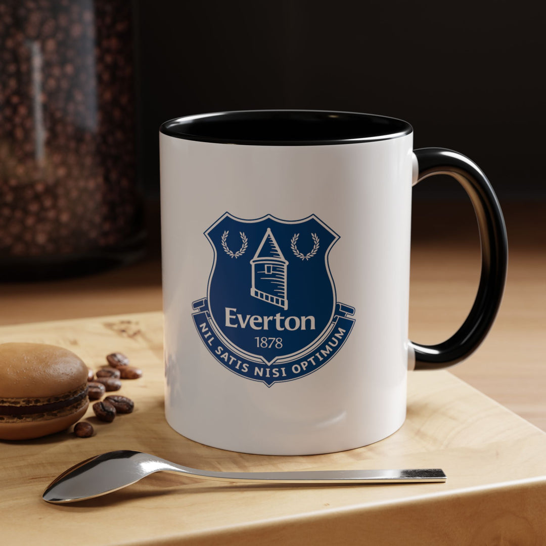 Bold black Everton tea mug featuring the official club crest, perfect for any coffee or tea lover who is also a fan of The Toffees. Durable and stylish, it’s a versatile fan item for home, office, or gifting, combining practical use with team pride.