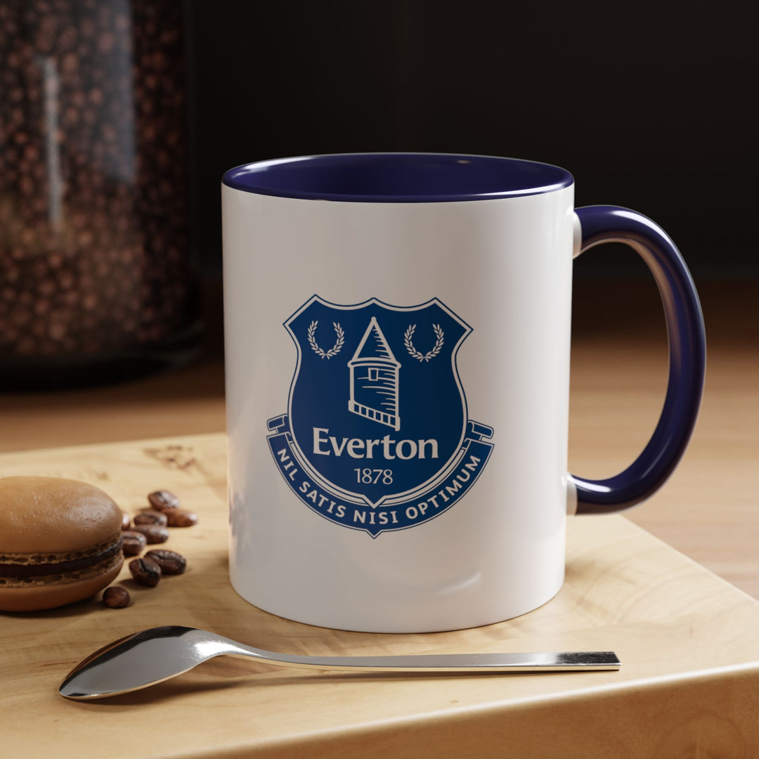 Deep navy blue makes this Everton tea mug a sleek way to enjoy coffee or tea while showing support for The Blues. Sturdy ceramic construction and ergonomic handle make it perfect for everyday use, fan collections, or gifting to loyal Evertonians.