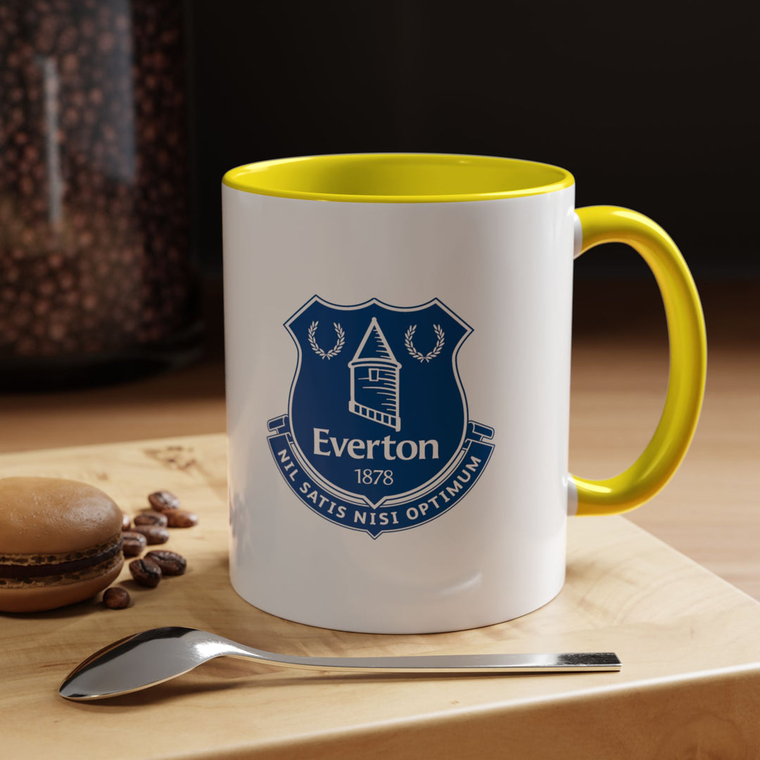 Bright and cheerful, this yellow Everton tea mug with the club crest adds a pop of color to your coffee or tea routine. Designed for fans who want a lively, practical, and collectible mug for match days, office breaks, or home enjoyment.