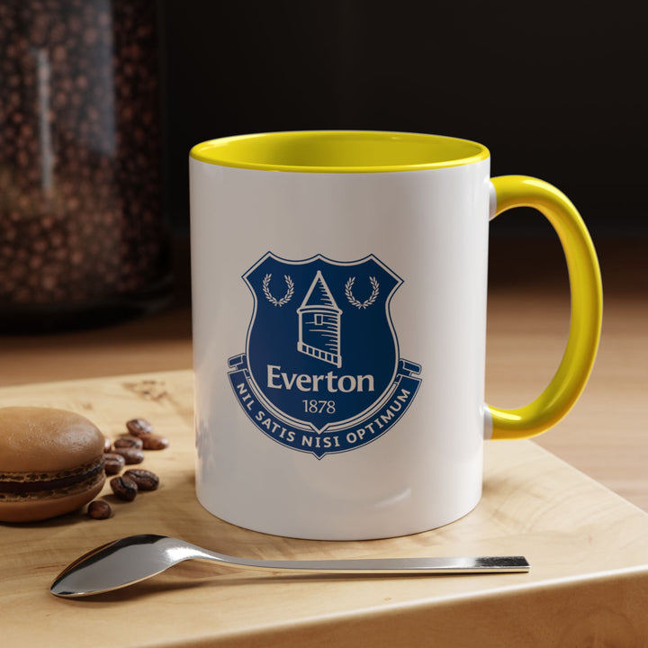 Bright and cheerful, this yellow Everton tea mug with the club crest adds a pop of color to your coffee or tea routine. Designed for fans who want a lively, practical, and collectible mug for match days, office breaks, or home enjoyment.