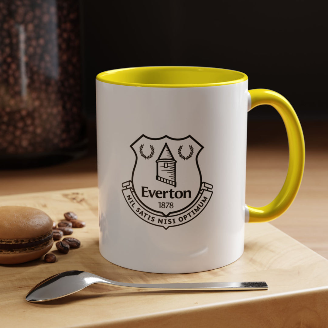 Everton Coffee Mug in bright yellow with the official club crest, perfect for fans who want bold, energetic supporter merchandise. Suitable for coffee, tea, or hot chocolate, with durable ceramic construction and a comfortable handle for daily use. A thoughtful gift for The Toffees supporters or a vibrant addition to any fan’s kitchen or office space.