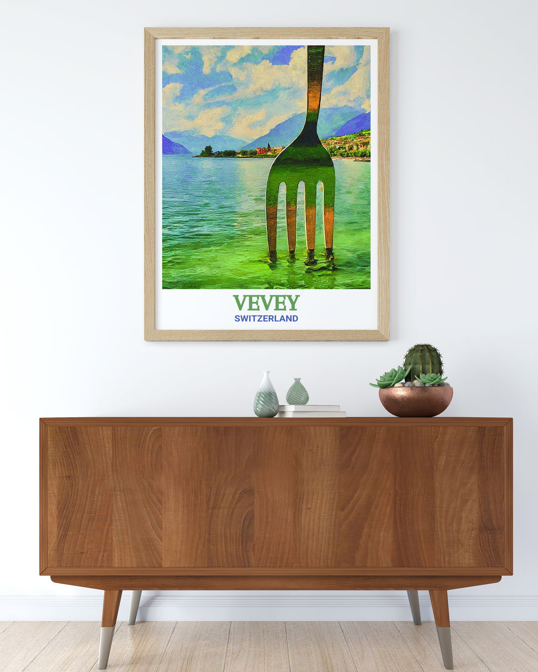 Vevey art print highlighting the stunning landscapes of Lake Geneva with the Fork of Vevey sculpture. This Switzerland wall art is ideal for those who love travel prints and want to capture the charm of Switzerland in their home.