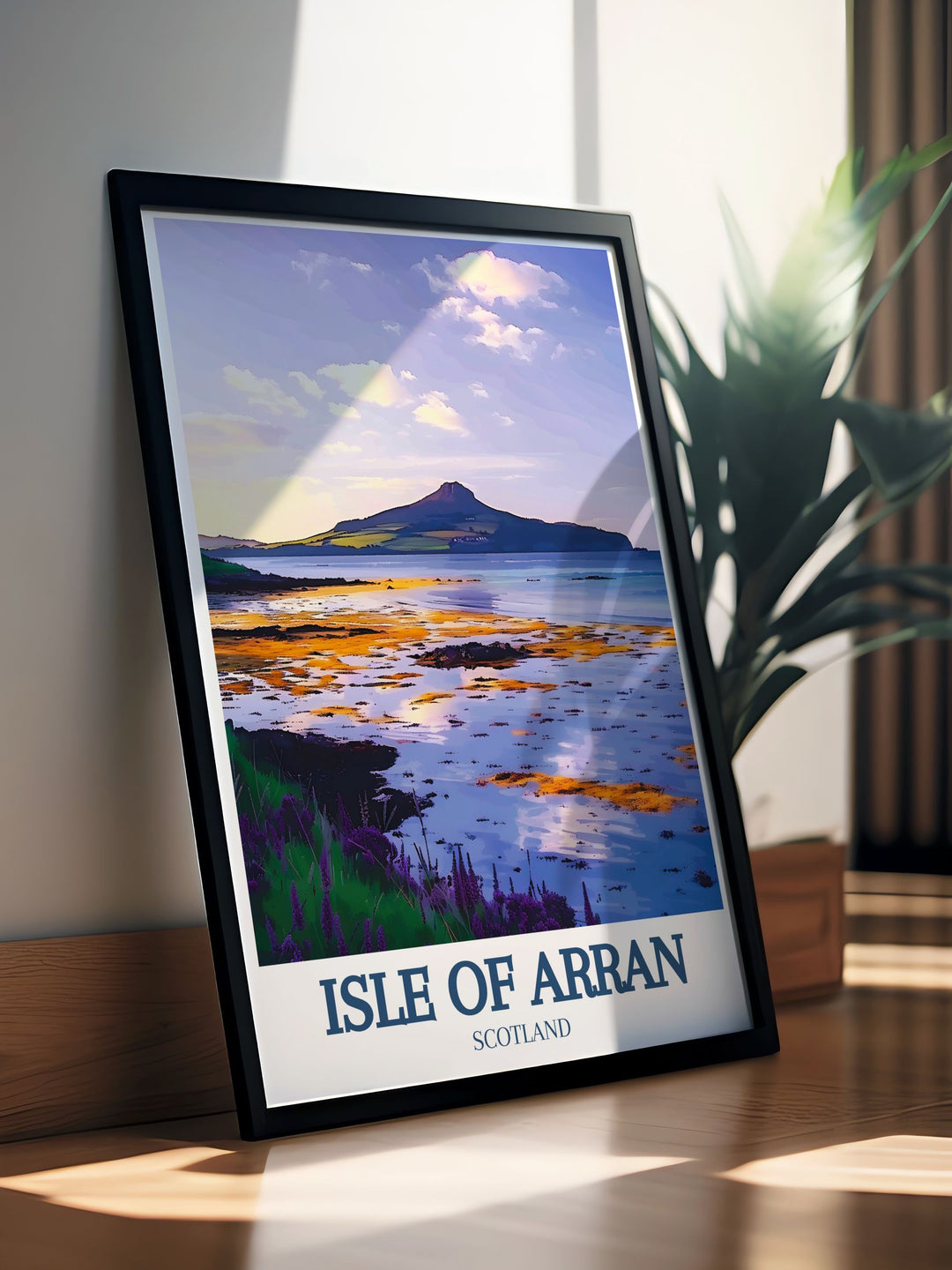 A framed art piece showcasing Blackwaterfoot Beach at sunset, highlighting the beautiful colors of the sky reflecting off the waves. This print is perfect for those who wish to bring a piece of Scotlands coastal charm into their home.