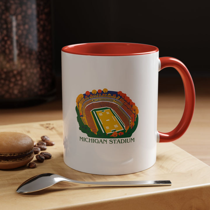 This ceramic Michigan Stadium mug features bold designs celebrating one of America’s most iconic stadiums. Perfect for coffee or tea, it is dishwasher-safe, microwave-friendly, and a cherished keepsake for sports fans and alumni.