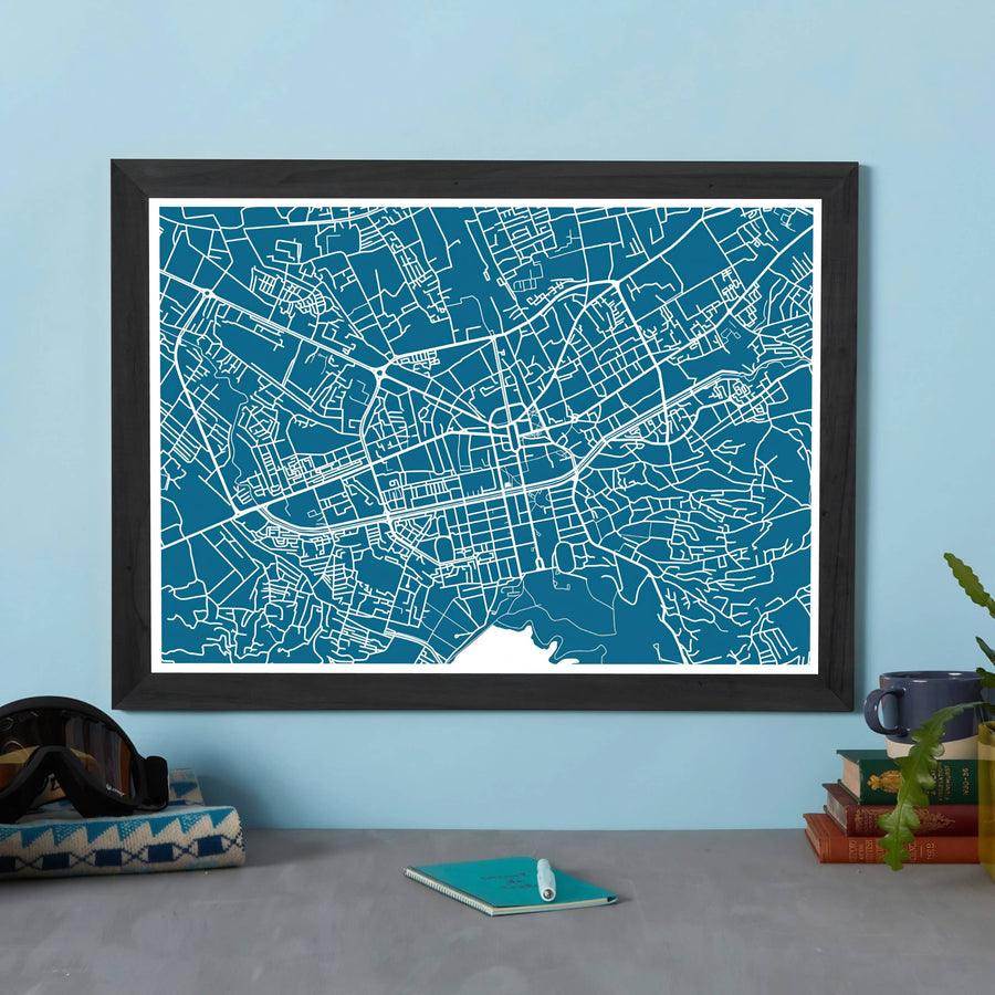 Detailed road networks and municipal arteries converge around downtown Tirana in this modern teal geography poster from central Albania. Provided by MapYourDreams with multiple finishes like unframed art paper, custom wooden frames, and gallery canvas wraps.
