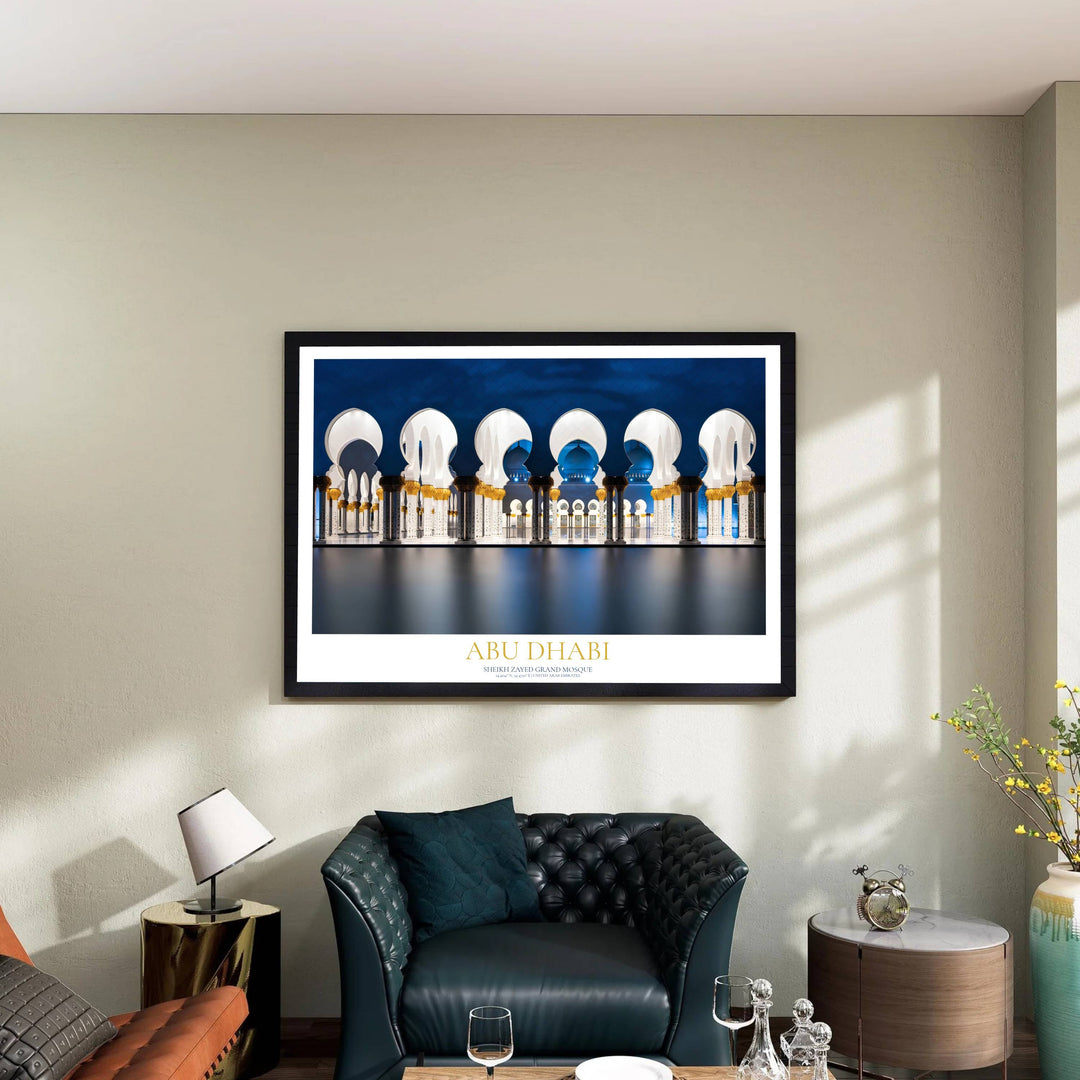 Abu Dhabi Grand Mosque nighttime archway arcade with golden pillars and blue sky reflection pool. Presented by MapYourDreams, this art piece comes in flexible formats including unframed paper, custom wooden frames, and high quality canvas wraps to complement modern living room decor.