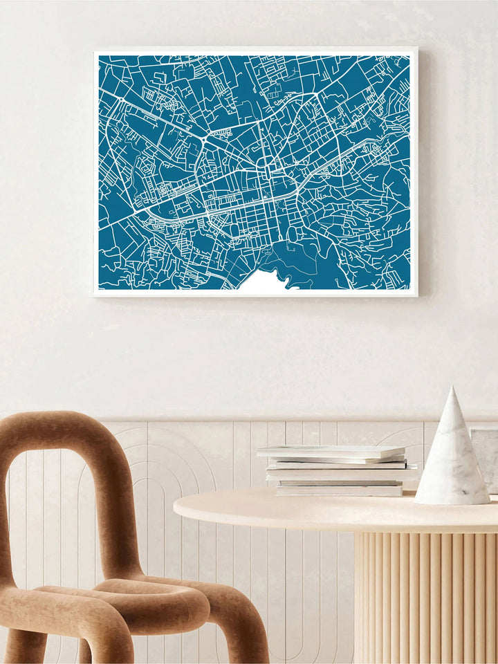 Pure white linework contrasts sharply against a deep teal-blue field in this elegant Tirana map poster featuring wide landscape framing. Offered by MapYourDreams in custom choices such as unframed paper, wood-framed options, and gallery-style canvas.