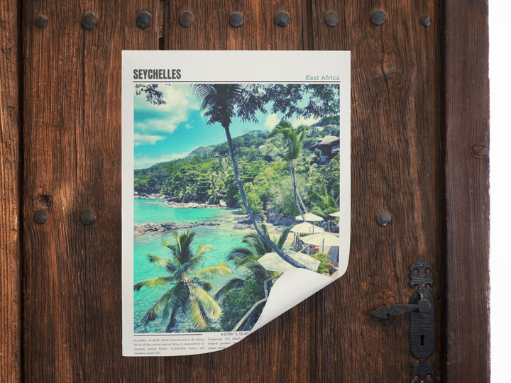 a picture of a tropical beach is taped to a wooden door
