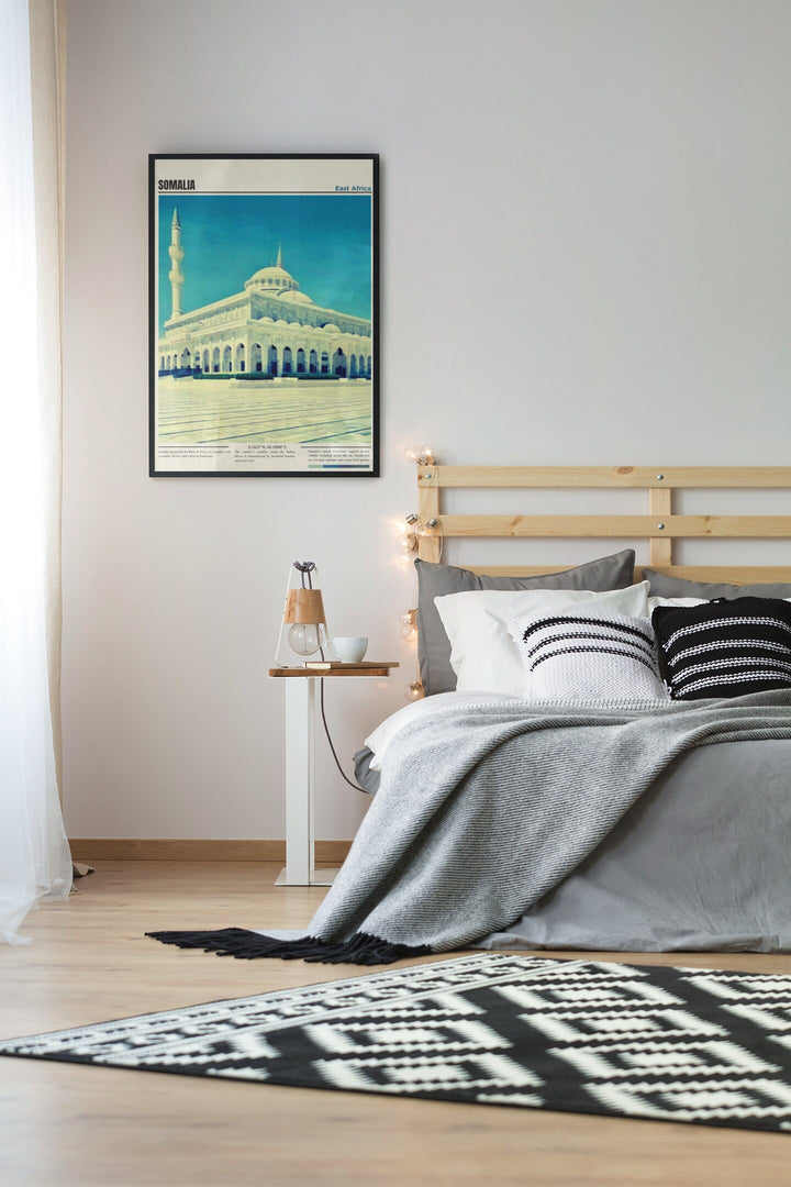 a bedroom with a bed and a painting on the wall