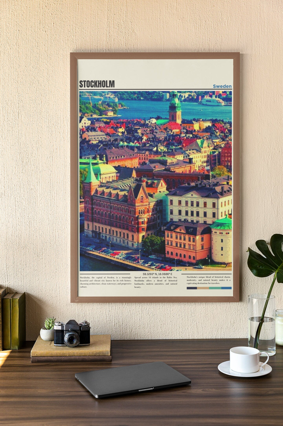 a picture of a city is hanging on a wall