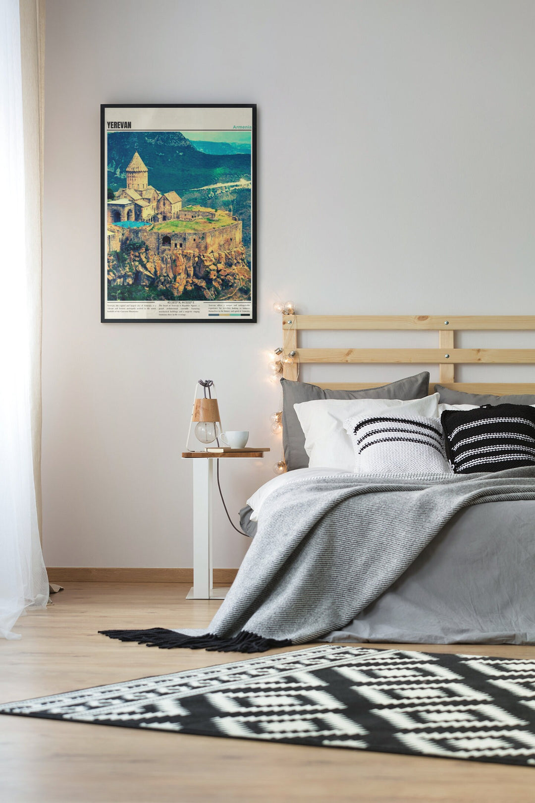 a bedroom with a bed and a painting on the wall