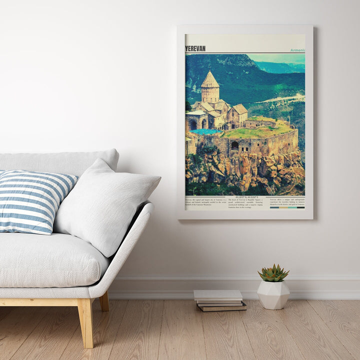 a white couch sitting in a living room next to a white wall