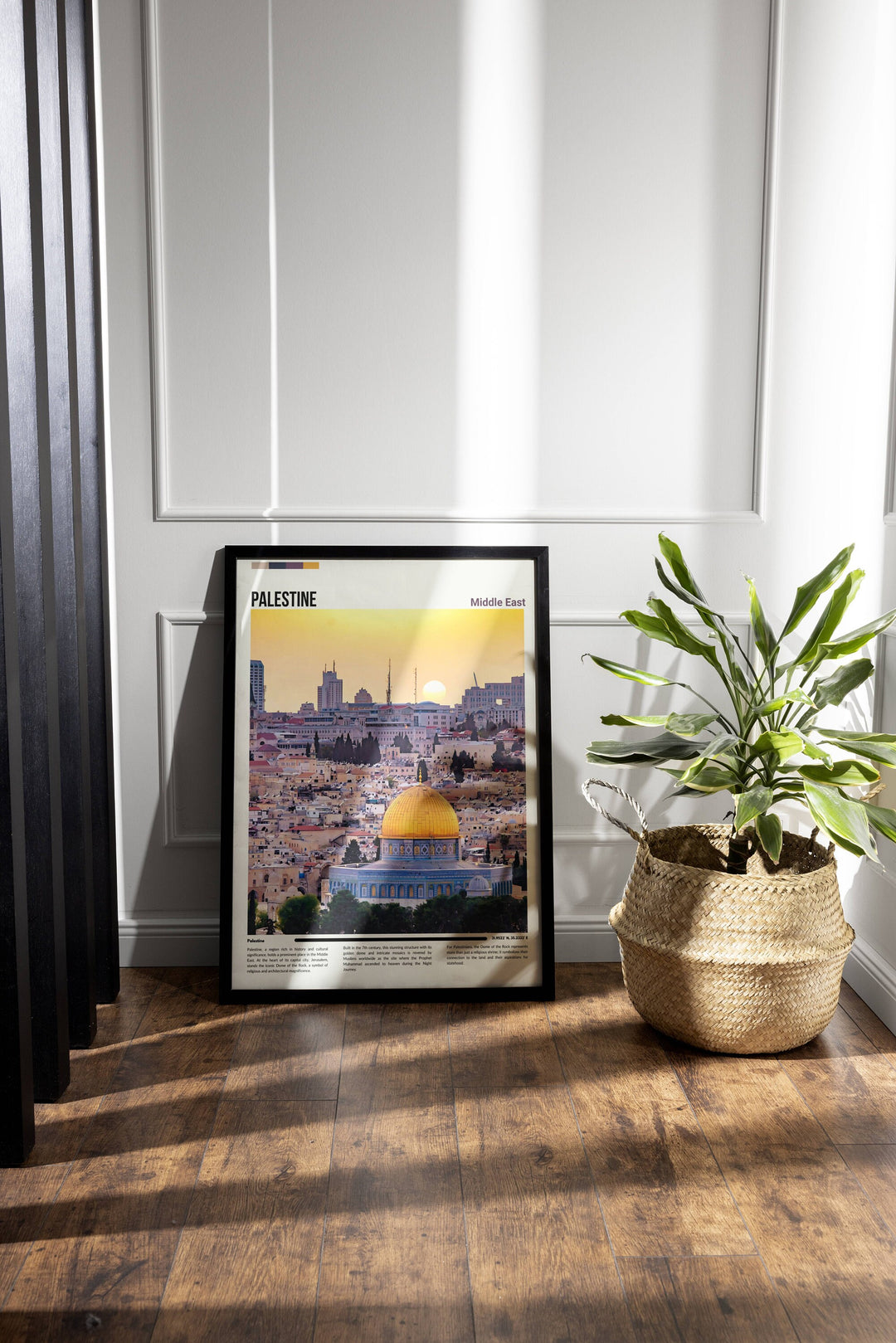 a potted plant sitting next to a picture of a city