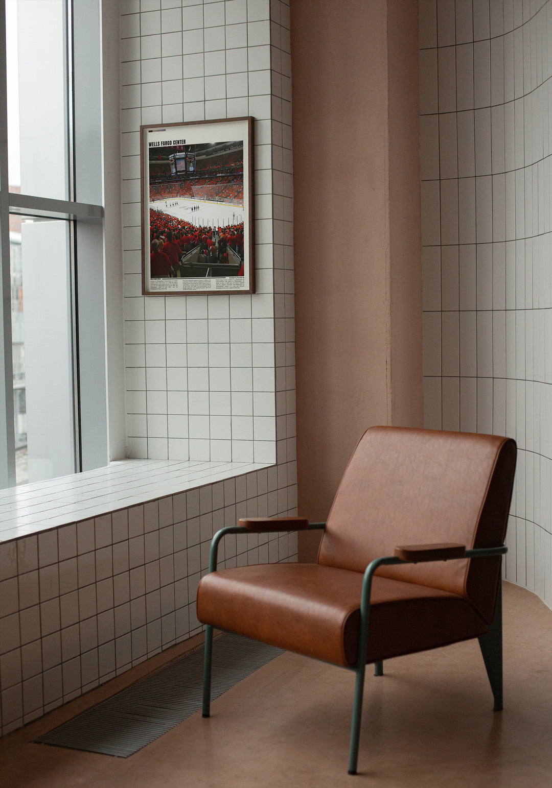 a brown chair sitting in a room next to a window