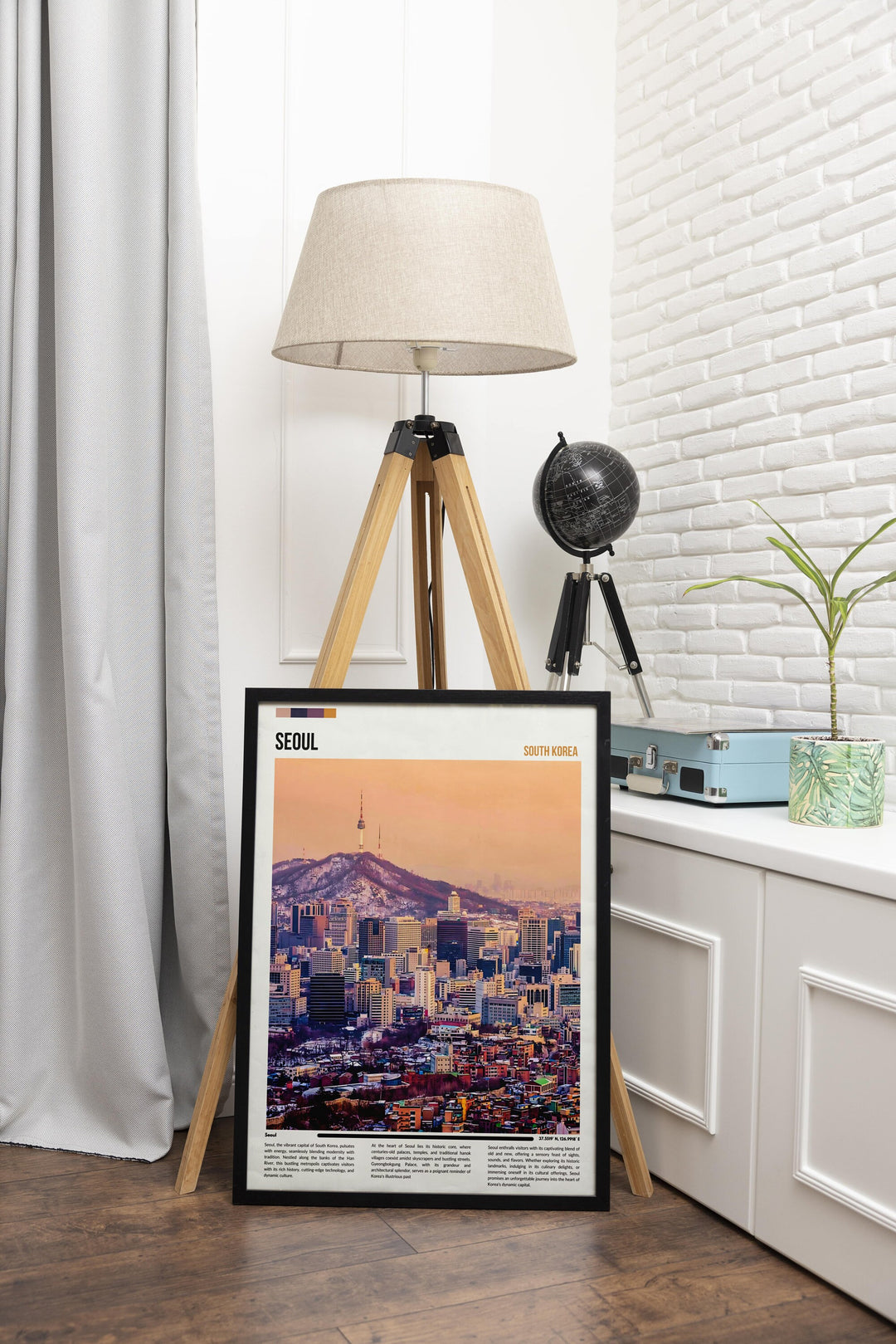 a picture of a city is on a tripod next to a lamp