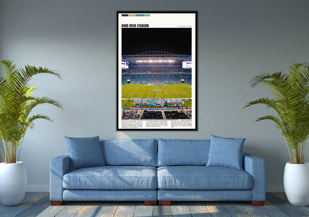 a living room with a blue couch and a picture of a football field