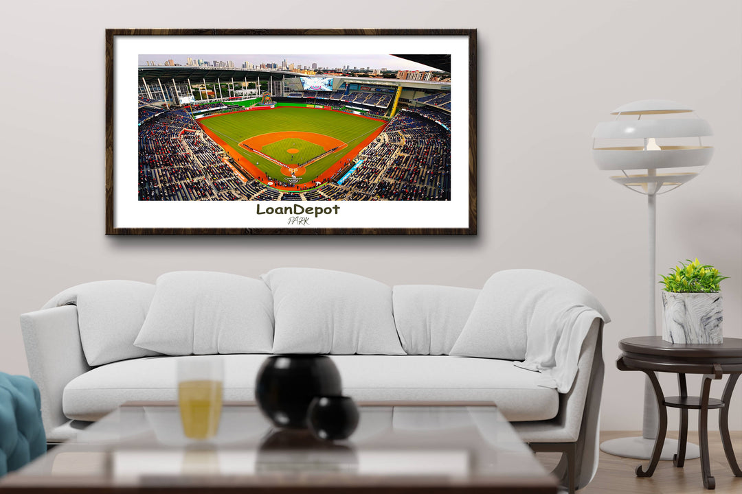 a living room with a couch and a picture of a baseball field