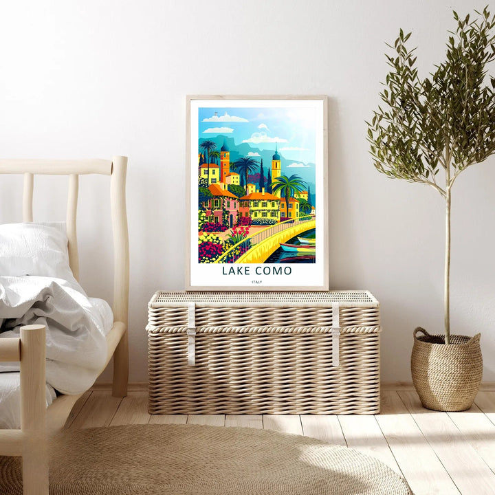 white Framed Lake Como wall art with vibrant pink villas and lush botanical greenery, perfect for a bright modern living room.