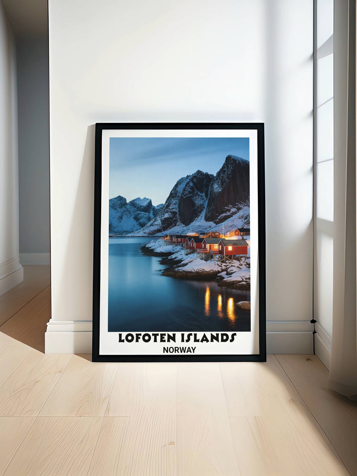 Lofoten Islands winter landscape print showing dramatic snow-capped mountain peaks, turquoise fjord water, glowing red cabin lights, golden reflections