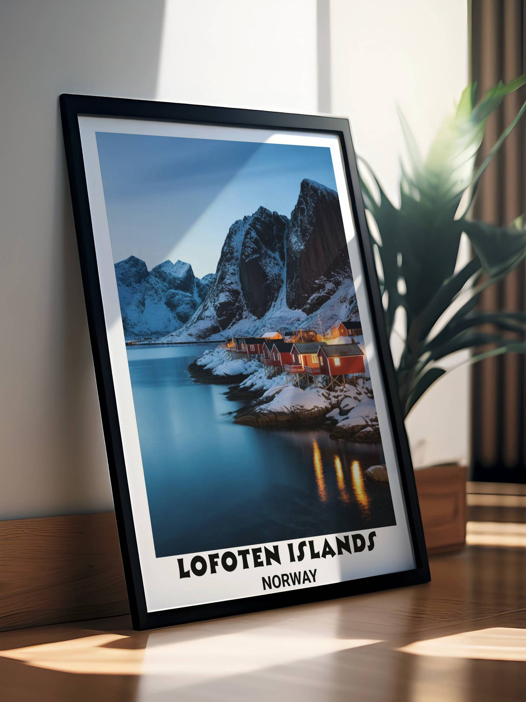 Scandinavian travel wall art print of Lofoten Islands showing crystalline turquoise fjord, dramatic cliff formations, snow terrain, illuminated cabins
