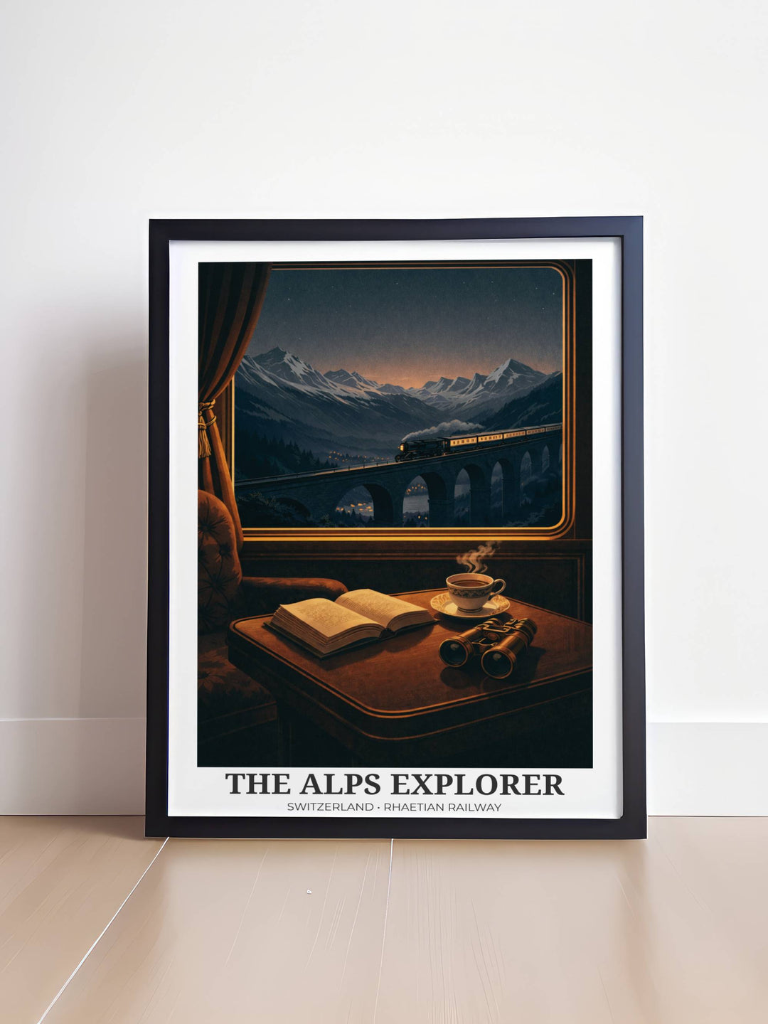 Framed artwork of a train journey through the Alps with a book and cup on a table.