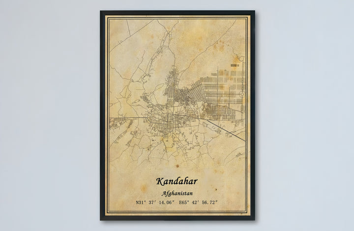 Parchment travel map poster displaying the street plan and cartographic grid of Kandahar, Afghanistan, under delicate vintage distressing. Provided by MapYourDreams as an unframed paper print, a gallery canvas wall decor piece, or a custom framed wall art item in retro black and grey frames.