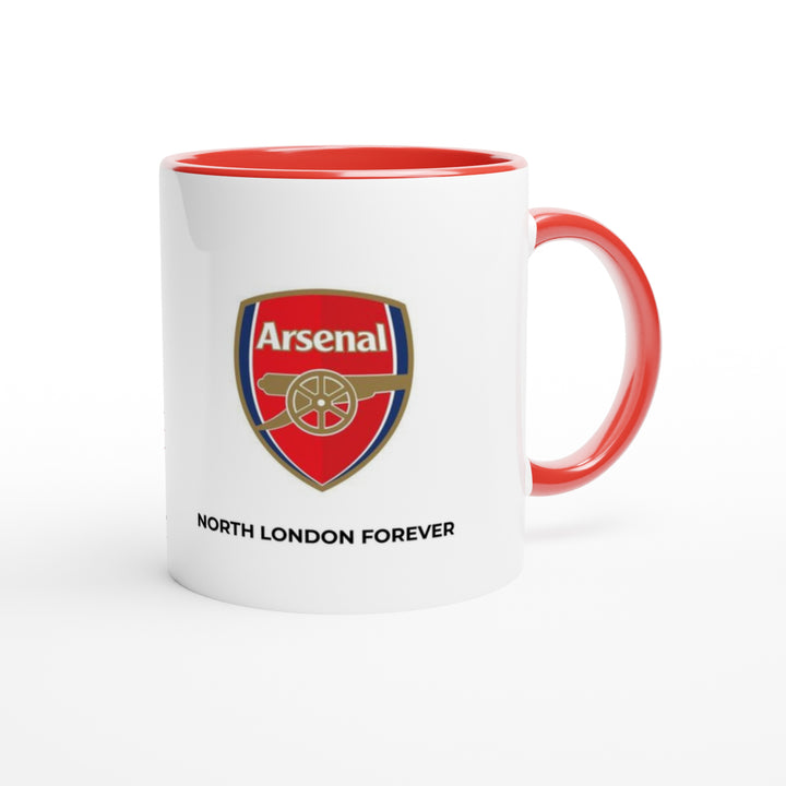 Close-up of a high-quality Arsenal cup showing the red interior lining, an ergonomic handle, and bold sans-serif text detailing a VAR goalkeeper foul review.