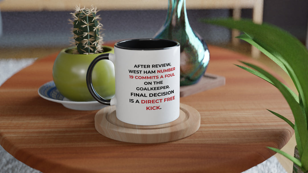 Unique black Gooner merchandise featuring a modern sports mug design that pairs the official Arsenal shield with funny match decision text for a premium look.