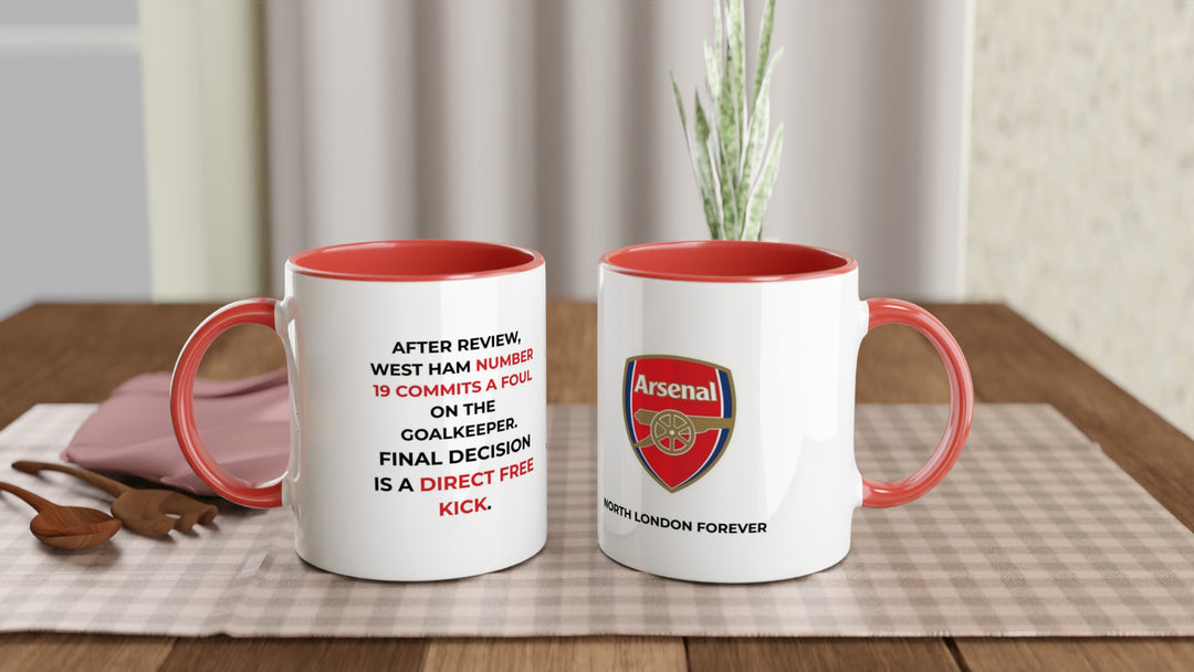 Funny Arsenal VAR coffee mug by MapYourDreams featuring a red rim and handle with the precise referee match decision quote against West Ham in bold typography.