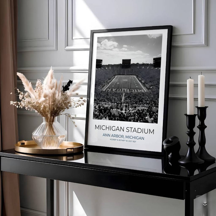 Radiant sports wall art photo print of Michigan Stadium with clean typographic styling and dramatic black and white tones. Presented by MapYourDreams, this artwork is available in flexible options including unframed paper, custom wooden frames, and gallery canvas wraps for timeless wall decor.