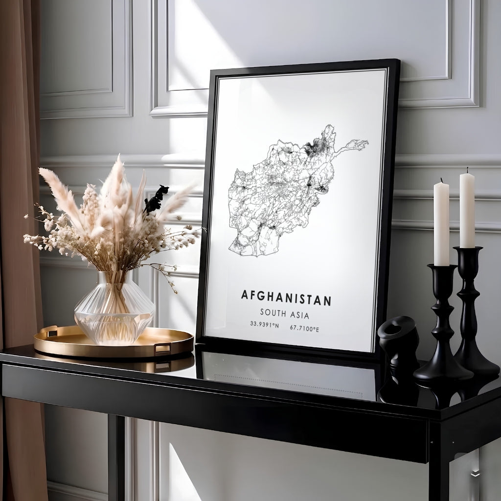 Black and white Afghanistan country map print featuring bold typography and exact latitude longitude coordinates, produced by MapYourDreams as an unframed paper print, ready to hang gallery canvas, or custom framed wall art setup in gold, silver, and grey frame finishes.